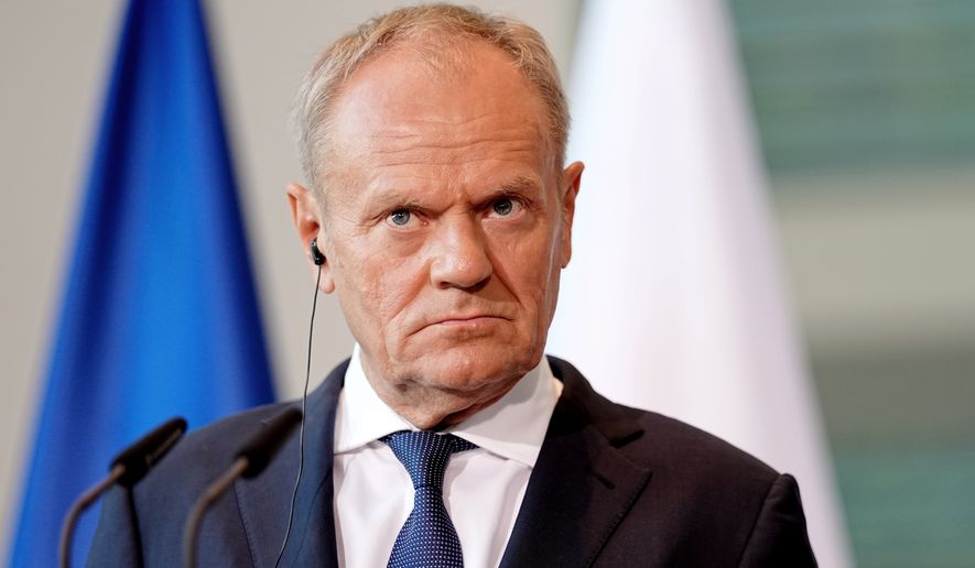 Polish Prime Minister Donald Tusk looks on during a press conference during the E5 summit of leading European nations ahead of the upcoming NATO summit, in Berlin, Wednesday June 24, 2026. (Kay Nietfeld/dpa via AP, File)