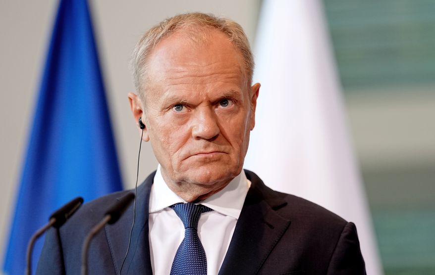 Polish Prime Minister Donald Tusk looks on during a press conference during the E5 summit of leading European nations ahead of the upcoming NATO summit, in Berlin, Wednesday June 24, 2026. (Kay Nietfeld/dpa via AP, File)