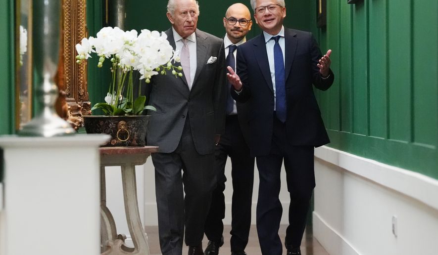Britain's King Charles III, left, walks with Nvidia chief executive Jensen Huang, right, and Sir Demis Hassabis to a meeting for leaders from the artificial intelligence (AI) sector, government, and thought leaders to discuss how AI can be developed and deployed in ways that benefit society, at Dumfries House in Cumnock, Scotland, Thursday Sept. 17, 2026. (Jonathan Brady/PA via AP, Pool)