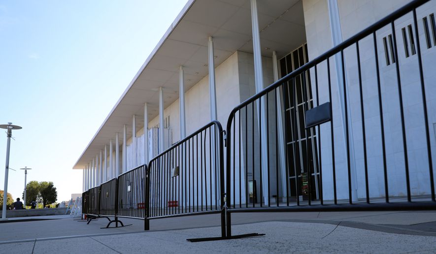 Fencing is installed at the John F. Kennedy Center for the Performing Arts, Wednesday, Sept. 16, 2026, in Washington. (AP Photo/Rahmat Gul)