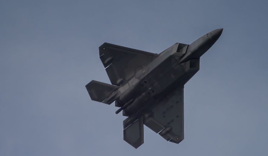 F22 Raptor flying over Hampton, Va. File photo credit: Madmaxindiana via Shutterstock.