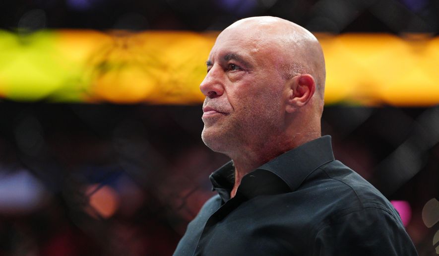 UFC commentator Joe Rogan stands in the arena after welterweight title fight at the UFC 330 mixed martial arts event Sunday, Aug. 16, 2026, in Philadelphia. (AP Photo/Derik Hamilton)
