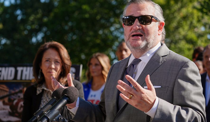 Sen. Ted Cruz, R-Texas, right, speaks as Sen. Maria Cantwell, D-Wash., left, listens during a news conference on Capitol Hill, Monday, Sept. 14, 2026, in Washington. (AP Photo/Mariam Zuhaib)