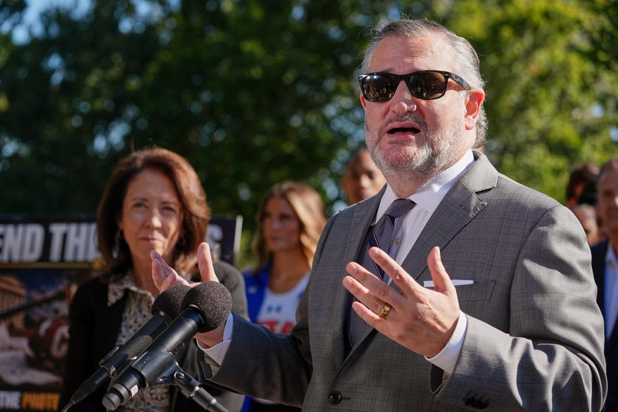 Sen. Ted Cruz, R-Texas, right, speaks as Sen. Maria Cantwell, D-Wash., left, listens during a news conference on Capitol Hill, Monday, Sept. 14, 2026, in Washington. (AP Photo/Mariam Zuhaib)
