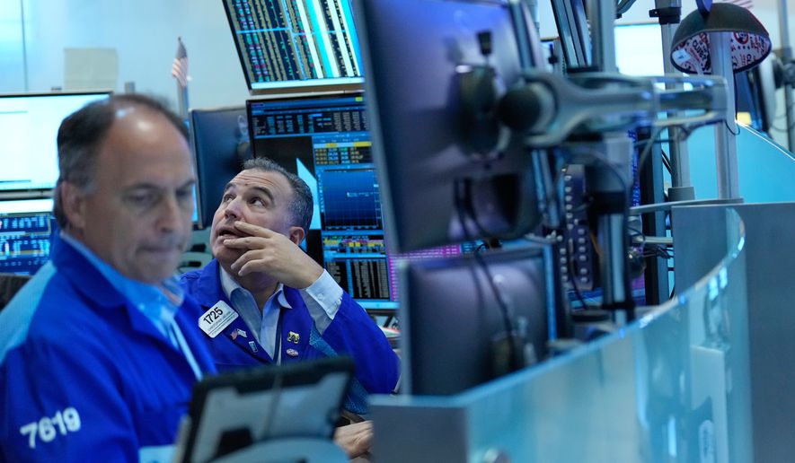 Christopher Lagana works on the floor at the New York Stock Exchange in New York, Monday, Sept. 14, 2026. (AP Photo/Seth Wenig)