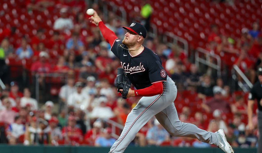 Washington Nationals starting pitcher Cade Cavalli throws during the first inning of a baseball game against the St. Louis Cardinals, Friday, Sept. 18, 2026, in St. Louis. (AP Photo/Scott Kane)