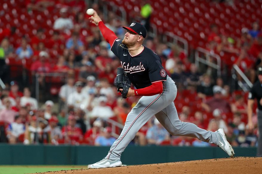 Washington Nationals starting pitcher Cade Cavalli throws during the first inning of a baseball game against the St. Louis Cardinals, Friday, Sept. 18, 2026, in St. Louis. (AP Photo/Scott Kane)