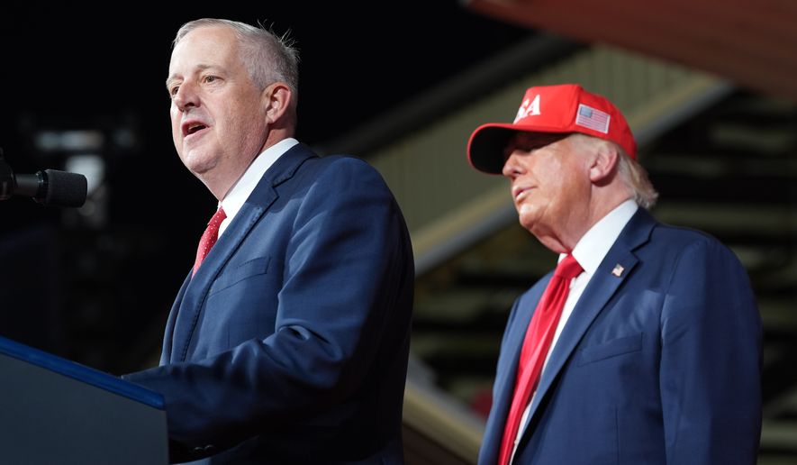 President Donald Trump listens as North Carolina Republican U.S. Senate candidate Michael Whatley speaks during a rally at Gastonia Municipal Airport, Wednesday, Sept. 16, 2026, in Gastonia, N.C. (AP Photo/Alex Brandon)