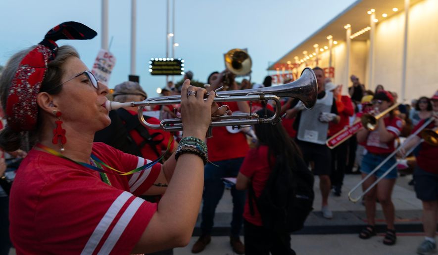 Musicians perform during the rally against the closing of the John F. Kennedy Center for the Performing Arts on Friday, Sept. 18, 2026, in Washington. ( (AP Photo/Jose Luis Magana)