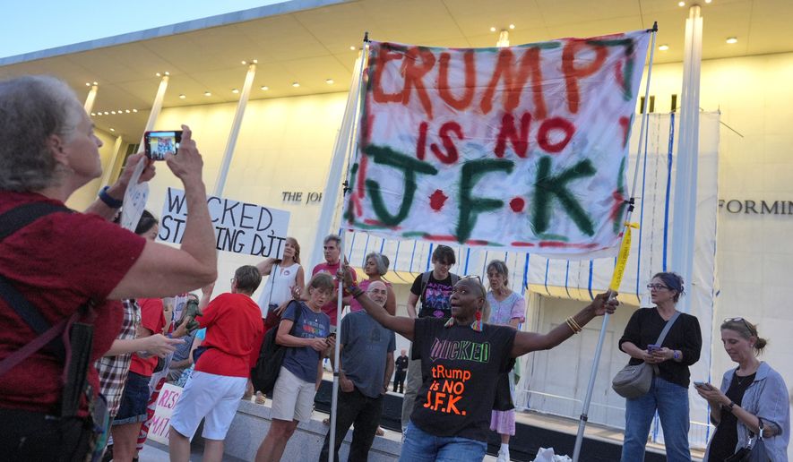 People protest outside the Kennedy Center over the threats by President Donald Trump to demolish the performing arts center, in Washington, Friday, Sept. 18, 2026. (AP Photo/J. Scott Applewhite)