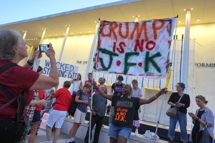 People protest outside the Kennedy Center over the threats by President Donald Trump to demolish the performing arts center, in Washington, Friday, Sept. 18, 2026. (AP Photo/J. Scott Applewhite)