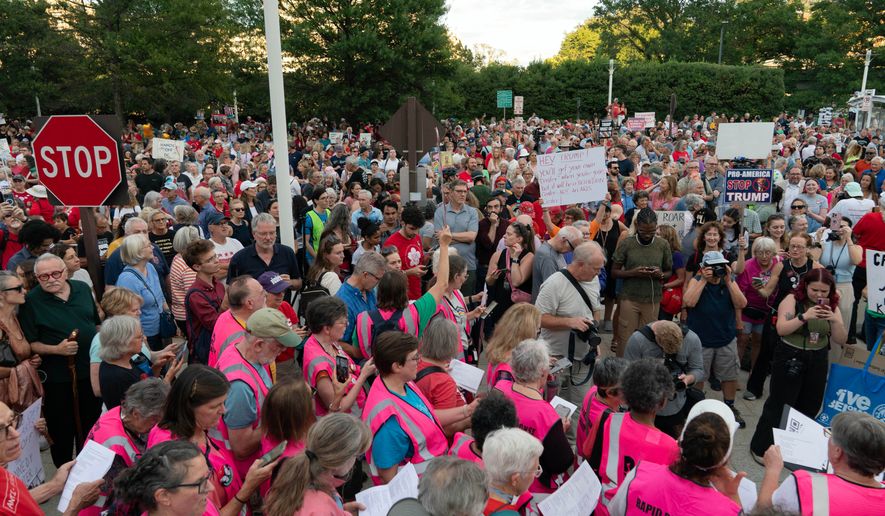 People rally against the closing of the John F. Kennedy Center for the Performing Arts on Friday, Sept. 18, 2026, in Washington. ( (AP Photo/Jose Luis Magana)