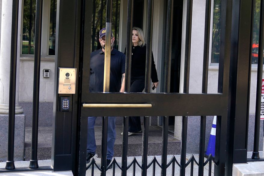 CNN Senior White House Reporter Betsy Klein, right, departs after having her credential revoked following President Donald Trump's ban on CNN, MS NOW and Politico, at the White House, Saturday, Sept. 19, 2026, in Washington. (AP Photo/Jose Luis Magana)