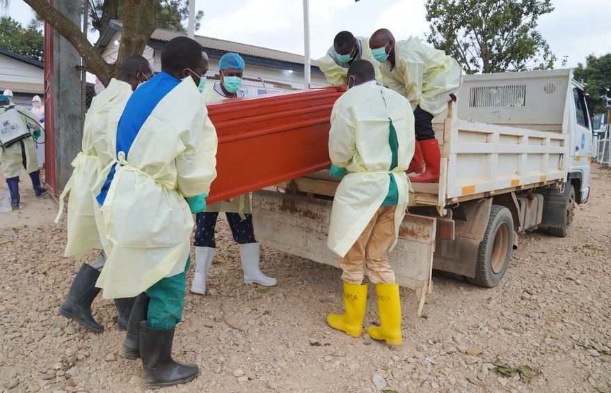 Health workers who are members of the safe and dignified burial team prepare to bury Abineno Justine, a 38 year old woman who died of the Ebola virus, in Bunia, Congo, Friday, Sept. 4, 2026. (AP Photo/Dieudonne Dirole)
