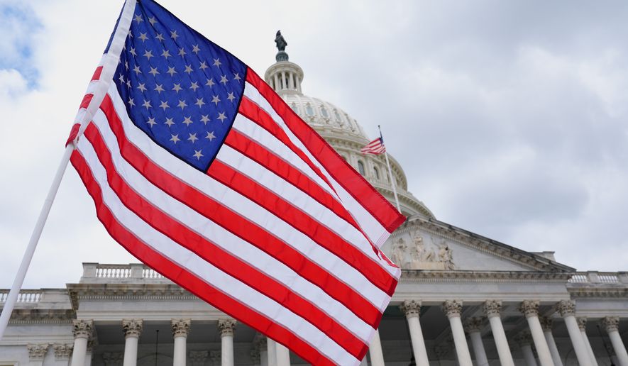 The U.S. flag flies in font of the Capitol, on June 8, 2026, in Washington. (AP Photo/Mariam Zuhaib, File)