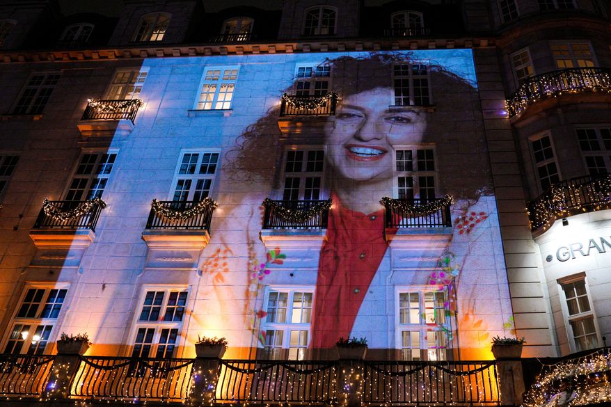 A photo of Nobel Peace Prize recipient Narges Mohammadi is projected onto the wall of the Grand Hotel in central Oslo before the Nobel banquet on Dec. 10. 2023. (Javad Parsa/NTB Scanpix via AP, File)