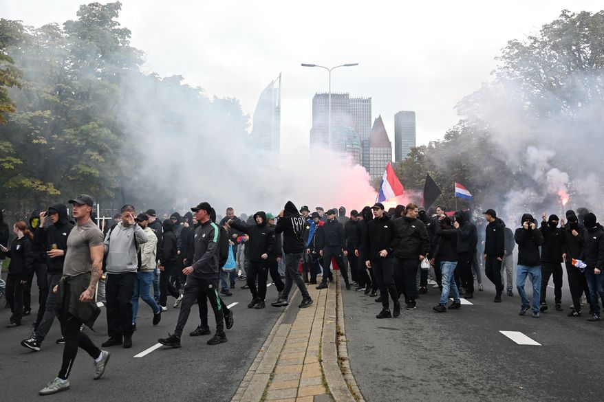Protesters attend a far-right groups' protest against immigration and asylum policies, in The Hague, Netherlands, Saturday, Sept. 19, 2026. (AP Photo/Mouneb Taim)