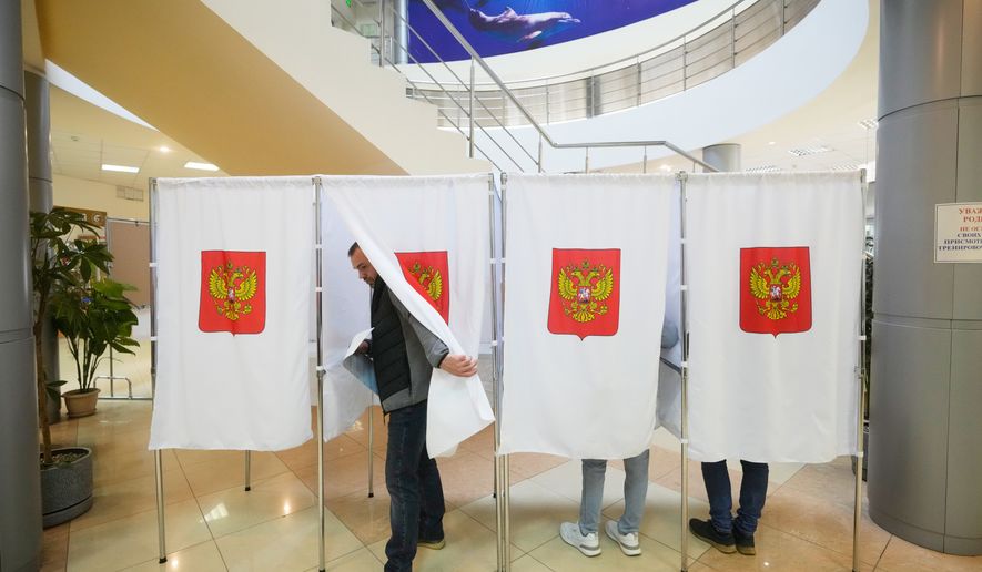 A voter leaves a polling booth after casting a vote during the parliamentary election in Podolsk, Moscow region, Russia, Saturday, Sept. 19, 2026. (AP Photo/Pavel Bednyakov)