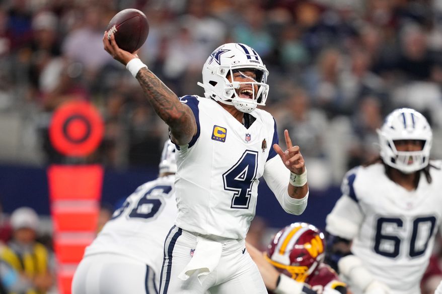 Dallas Cowboys quarterback Dak Prescott (4) passes against the Washington Commanders in the second half during an NFL football game in Arlington, Texas, Sunday, Sept. 20, 2026. (AP Photo/Tony Gutierrez)