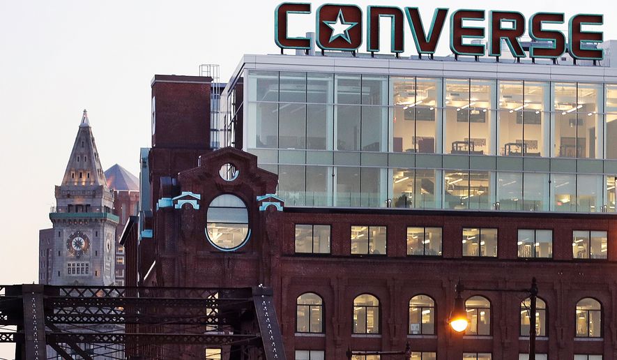 The Converse logo is displayed on the roof of the company's world headquarters in the West End neighborhood of Boston, Wednesday, Dec. 28, 2016. (AP Photo/Charles Krupa, file)