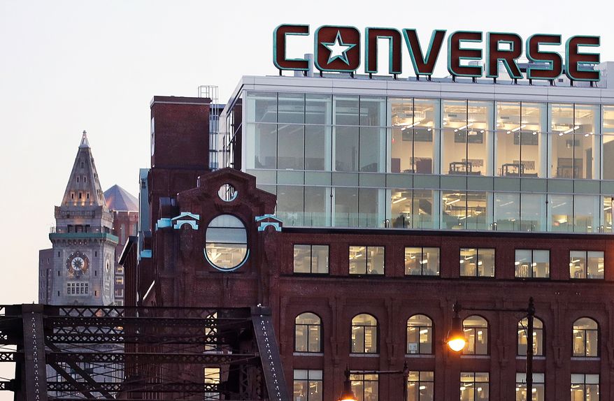 The Converse logo is displayed on the roof of the company's world headquarters in the West End neighborhood of Boston, Wednesday, Dec. 28, 2016. (AP Photo/Charles Krupa, file)