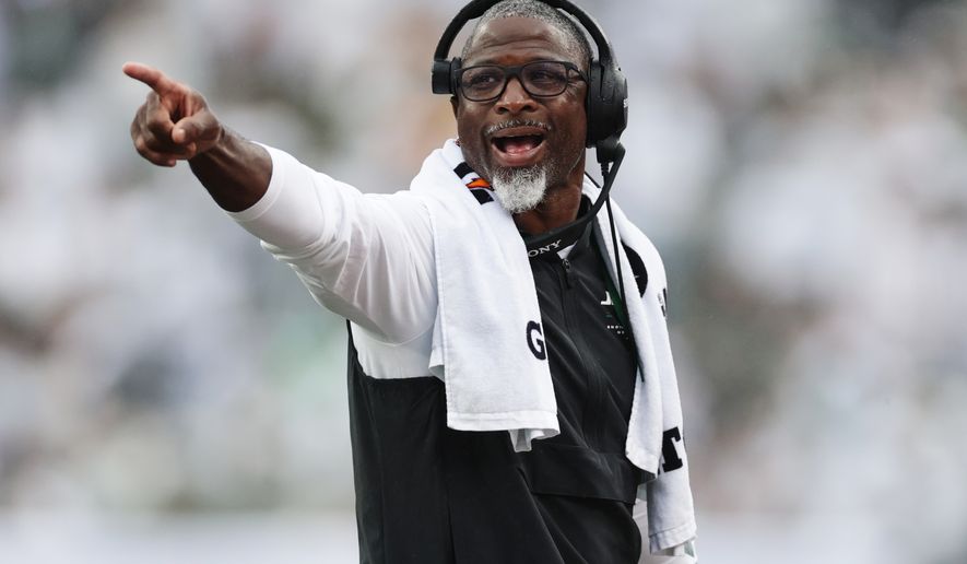 New York Jets head coach Aaron Glenn points on the field during an NFL football game against the Green Bay Packers in East Rutherford, N.J., Sunday, Sept. 20, 2026. (AP Photo/Adam Hunger)