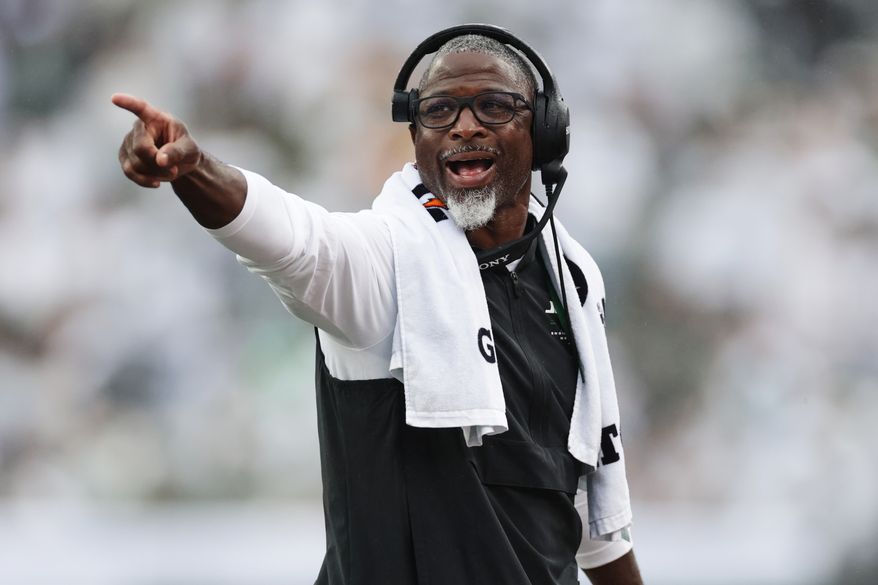 New York Jets head coach Aaron Glenn points on the field during an NFL football game against the Green Bay Packers in East Rutherford, N.J., Sunday, Sept. 20, 2026. (AP Photo/Adam Hunger)