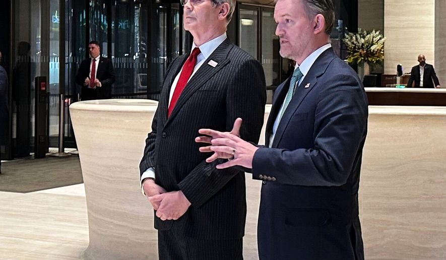 In this photo taken with a smartphone, U.S. Treasury Secretary Scott Bessent, left, and U.S. Trade Representative Jamieson Greer, address reporters in New York, Sunday, Sept. 20, 2026. (AP Photo/Matt Sedensky)