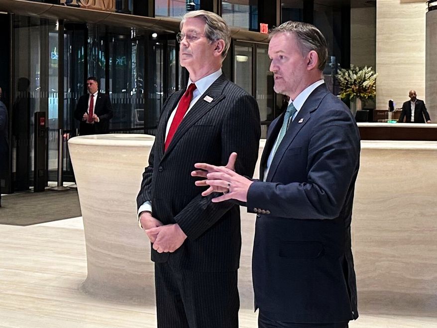 In this photo taken with a smartphone, U.S. Treasury Secretary Scott Bessent, left, and U.S. Trade Representative Jamieson Greer, address reporters in New York, Sunday, Sept. 20, 2026. (AP Photo/Matt Sedensky)