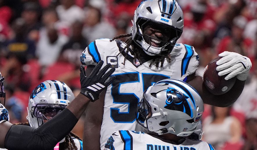 Carolina Panthers linebacker Devin Lloyd (55) celebrates touchdown after an interception during an NFL football game against the Atlanta Falcons in Atlanta, Sunday, Sept. 20, 2026. (AP Photo/Mike Stewart)