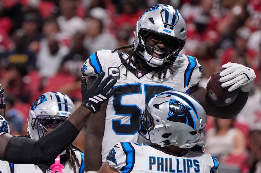 Carolina Panthers linebacker Devin Lloyd (55) celebrates touchdown after an interception during an NFL football game against the Atlanta Falcons in Atlanta, Sunday, Sept. 20, 2026. (AP Photo/Mike Stewart)