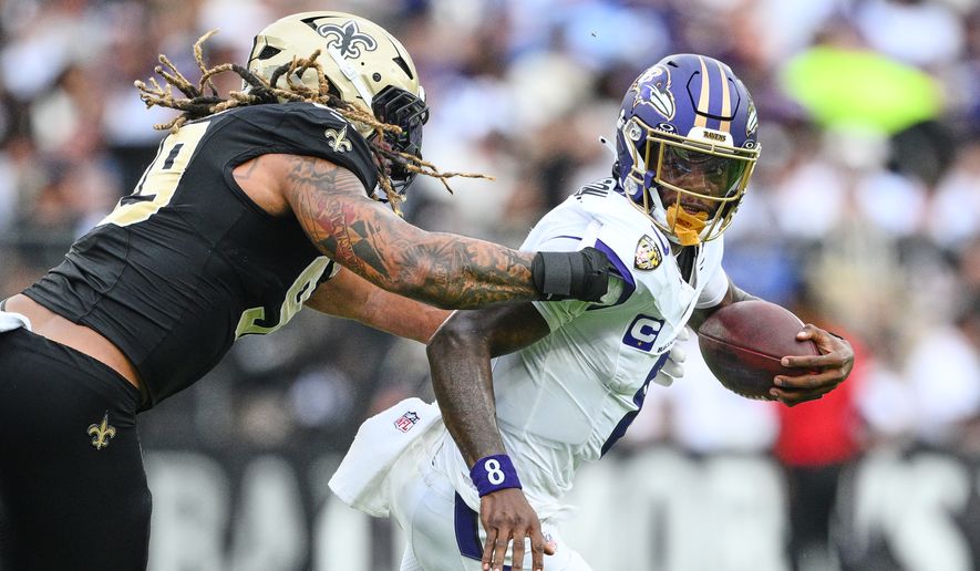 Baltimore Ravens quarterback Lamar Jackson is sacked by New Orleans Saints defensive end Chase Young (99) in the second half of an NFL football game in Baltimore, Sunday, Sept. 20, 2026. (AP Photo/Nick Wass)