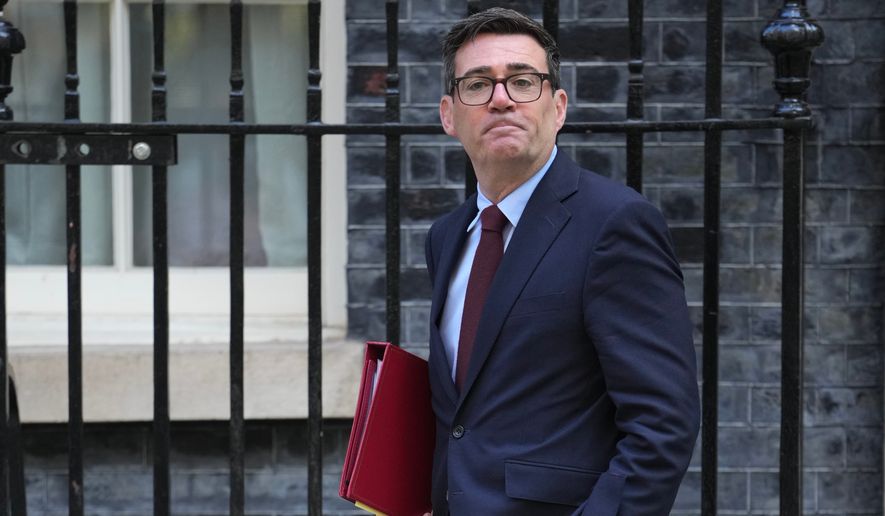 Britain's Prime Minister Andy Burnham leaves 10 Downing Street to attend the weekly Prime Ministers' Questions session in Parliament in London, Wednesday, Sept. 9, 2026. (AP Photo/Kin Cheung)