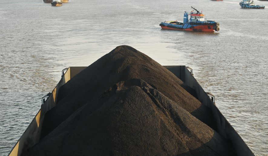 FILE - A barge is fully loaded with coal on the Mahakam River in Samarinda, East Kalimantan, Indonesia, Aug. 19, 2026. (AP Photo/Ahmad Mulia Panjaitan, File)