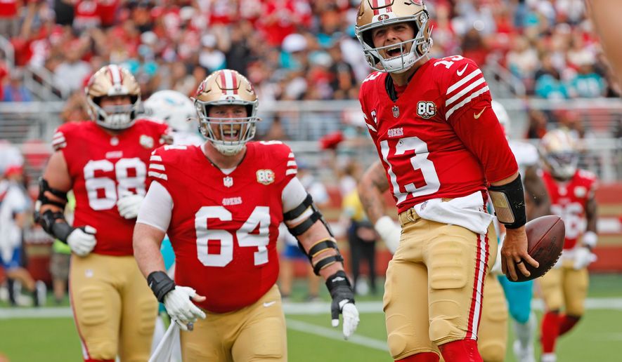 San Francisco 49ers quarterback Brock Purdy (13) scores a touchdown against the Miami Dolphins in the second quarter during an NFL game at Levi's Stadium in Santa Clara, Calif., on Sunday, Sept. 20, 2026. (Santiago Mejia/San Francisco Chronicle via AP)