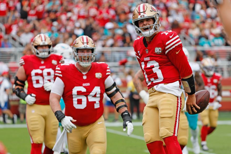San Francisco 49ers quarterback Brock Purdy (13) scores a touchdown against the Miami Dolphins in the second quarter during an NFL game at Levi's Stadium in Santa Clara, Calif., on Sunday, Sept. 20, 2026. (Santiago Mejia/San Francisco Chronicle via AP)