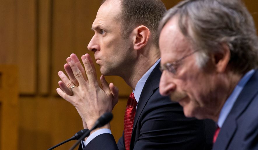 FILE - Austan Goolsbee, left, then-Council of Economic Advisers Chairman under President Barack Obama, testifies on Capitol Hill in Washingto, Feb. 28, 2013. (AP Photo/J. Scott Applewhite, File)
