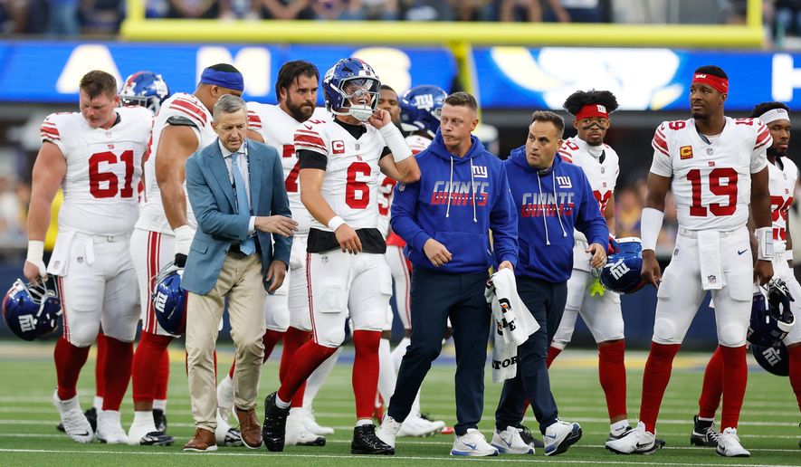 New York Giants quarterback Jaxson Dart (6) walks off the field with an injury during the first half of an NFL football game against the Los Angeles Rams in Inglewood, Calif., Monday, Sept. 21, 2026. (AP Photo/Caroline Brehman)