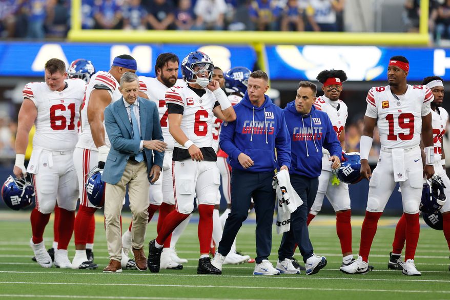 New York Giants quarterback Jaxson Dart (6) walks off the field with an injury during the first half of an NFL football game against the Los Angeles Rams in Inglewood, Calif., Monday, Sept. 21, 2026. (AP Photo/Caroline Brehman)