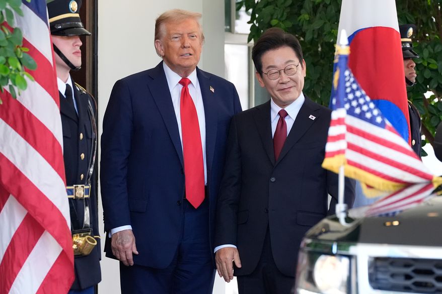 President Donald Trump, left, greets South Korean President Lee Jae Myung upon his arrival at the White House, on Aug. 25, 2025, in Washington. (AP Photo/Alex Brandon, File)