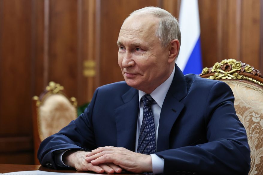 Russian President Vladimir Putin meets with Russian Federal Customs Service Valery Pikalev in Moscow, Monday, Sept. 21, 2026. (Vyacheslav Prokofyev, Sputnik, Kremlin Pool Photo via AP)