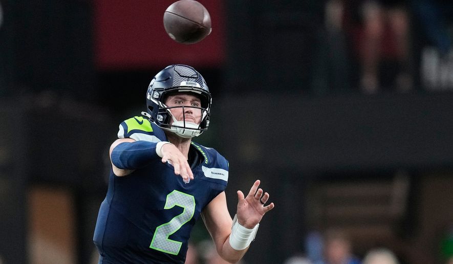 Seattle Seahawks quarterback Drew Lock throws against the Arizona Cardinals during the second half of an NFL football game in Glendale, Ariz., Sunday, Sept. 20, 2026. (AP Photo/Ross D. Franklin)