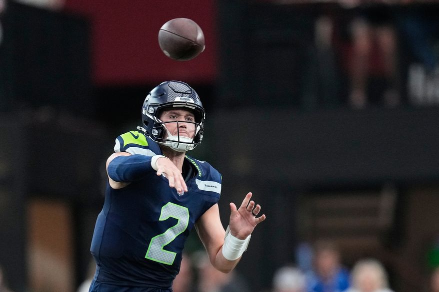 Seattle Seahawks quarterback Drew Lock throws against the Arizona Cardinals during the second half of an NFL football game in Glendale, Ariz., Sunday, Sept. 20, 2026. (AP Photo/Ross D. Franklin)