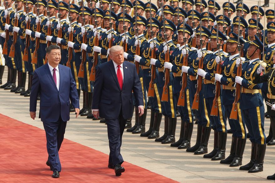 President Donald Trump, right, participates in a welcome ceremony with China's President Xi Jinping at the Great Hall of the People, May 14, 2026, in Beijing. (AP Photo/Mark Schiefelbein, File)