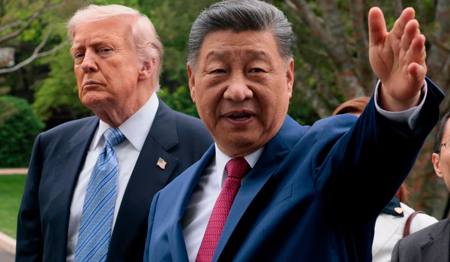 Chinese President Xi Jinping, right, gestures as he greets U.S. President Donald Trump at Zhongnanhai Garden in Beijing, China, on Friday, May 15, 2026. (Evan Vucci/Pool Photo via AP, Pool) **FILE**