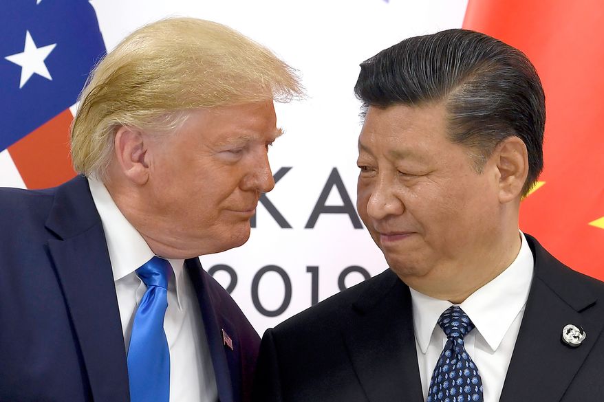 President Donald Trump, left, meets with Chinese President Xi Jinping during a meeting on the sidelines of the G-20 summit in Osaka, Japan, June 29, 2019. (AP Photo/Susan Walsh, File)