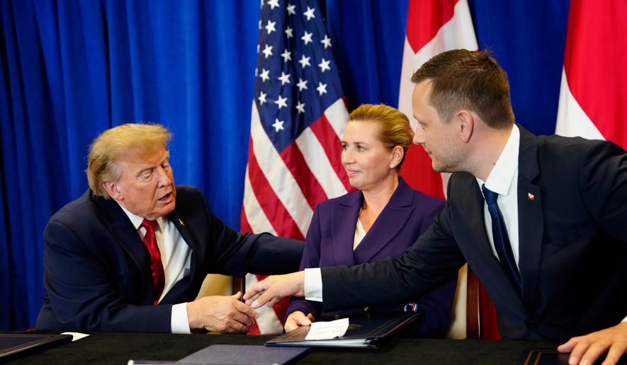 Denmark's Prime Minister Mette Frederiksen, center, Greenland's Prime Minister Jens-Frederik Nielsen, right, and U.S. President Donald Trump at the signing ceremony of a security deal among the U.S., Denmark and Greenland at United Nations headquarters, Tuesday, Sept. 22, 2026. (Mads Claus Rasmussen/Ritzau Scanpix via AP)