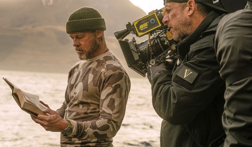 This image released by Paramount Pictures shows Brad Pitt, left, and director David Ayer on the set of "Heart of the Beast." (Scott Garfield/Paramount Pictures via AP)