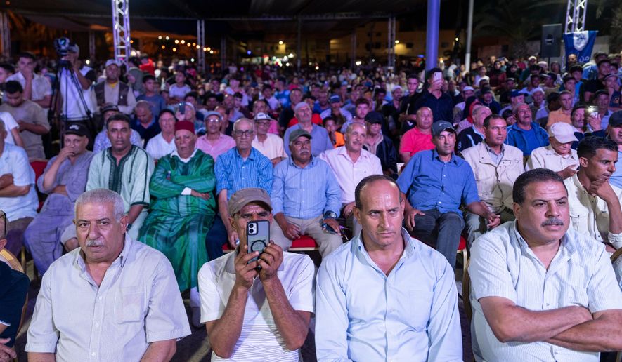 People attend an electoral rally for Authenticity and Modernity Party (PAM) ahead of the upcoming legislative elections, in Benslimane, Morocco, Sunday, Sept. 20, 2026. (AP Photo/Mosa'ab Elshamy)