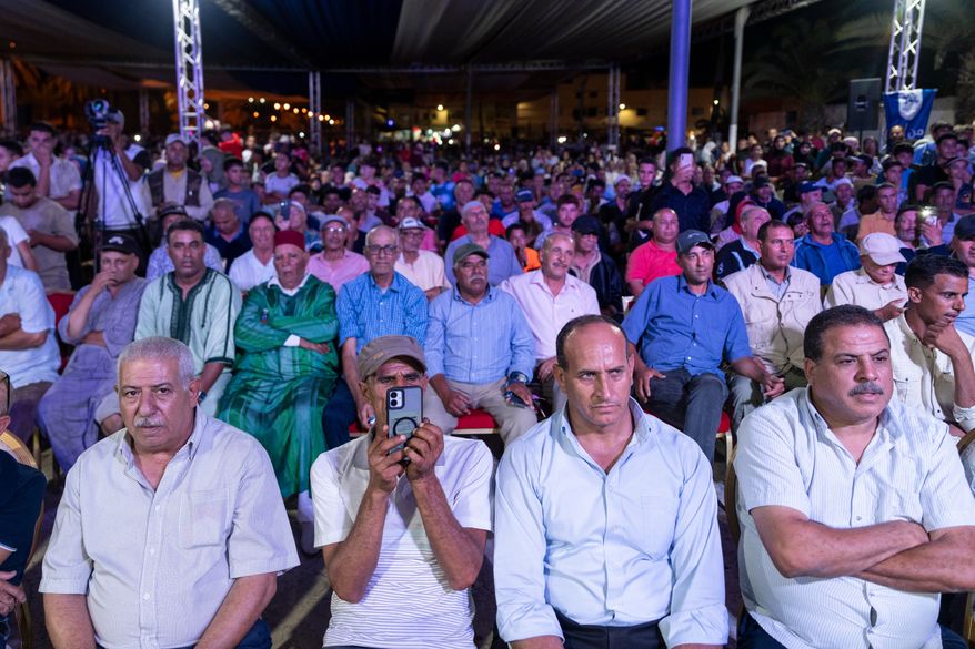 People attend an electoral rally for Authenticity and Modernity Party (PAM) ahead of the upcoming legislative elections, in Benslimane, Morocco, Sunday, Sept. 20, 2026. (AP Photo/Mosa'ab Elshamy)